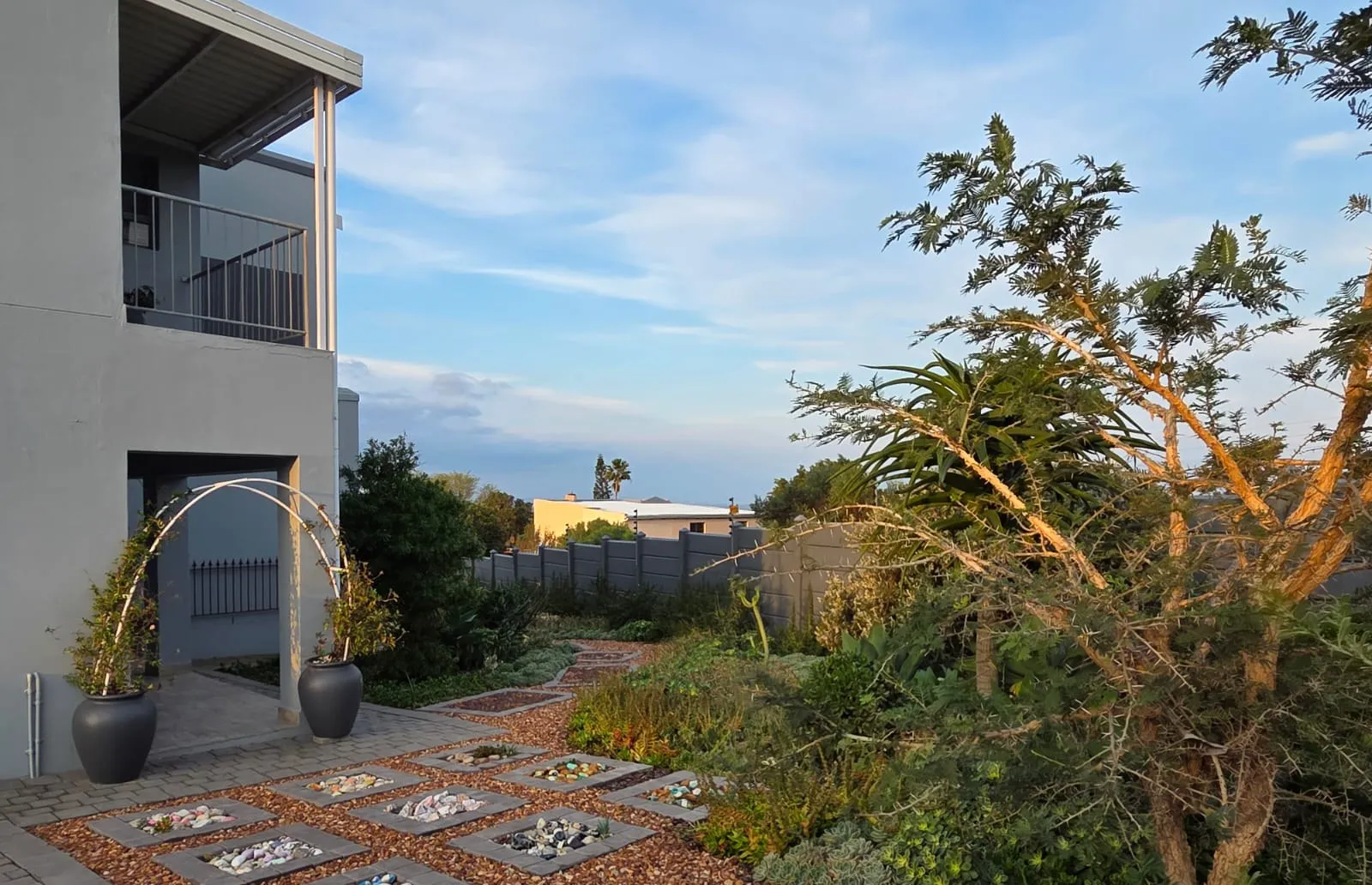 Stepping stones and gravel leading to the house