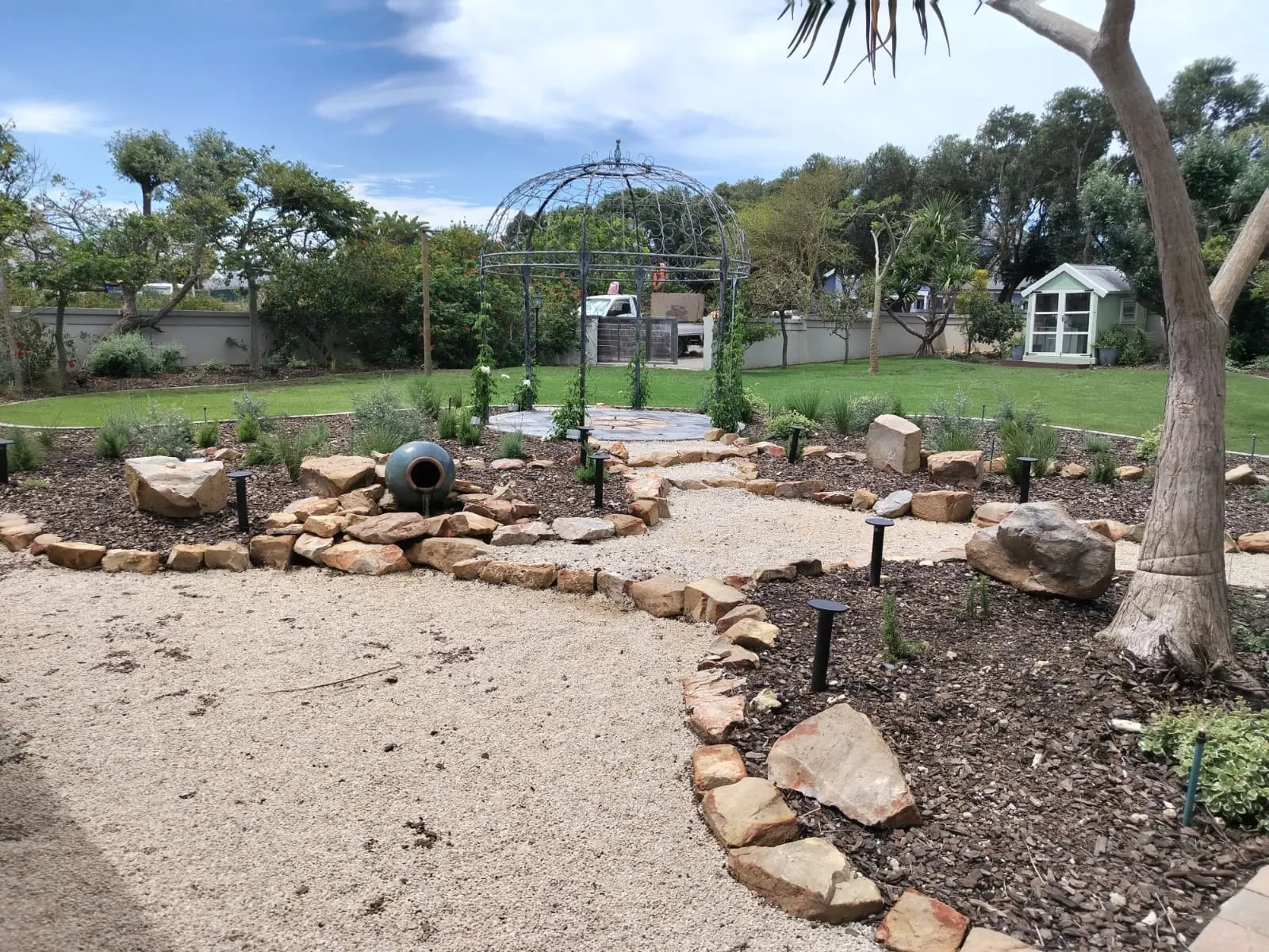 The stone pathway and layout of the garden
